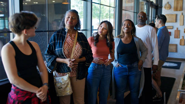 istock Diverse Group of Customers Waiting  in a Queue to Order in a BBQ Restaurant 2156725559