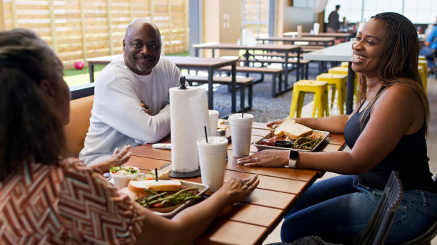 istock Three Mature Friends out for Lunch in Houston BBQ Restaurant 2156725582