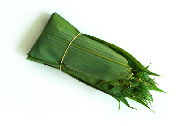 istock Bamboo leaves for rice dumpling on white background 2156725909