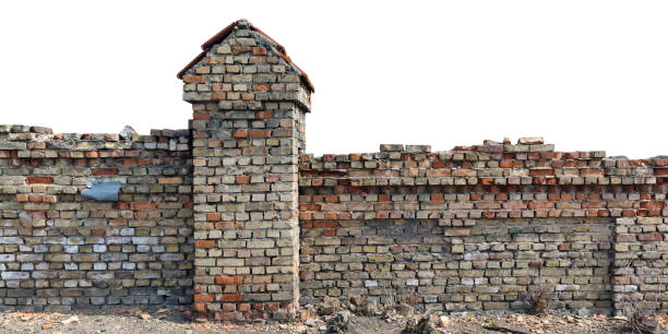 istock Very old destroyed fence made of clay bricks isolated 2156727388