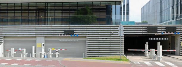 istock Barriers and control systems at entrances to underground parking lots 2156727405