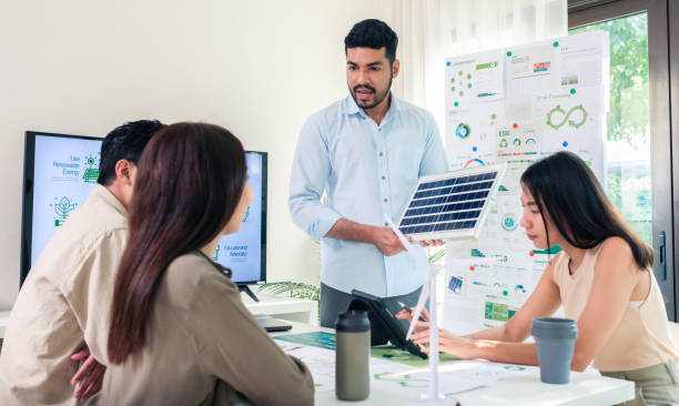 istock Diversity team presentation new design solar cell panel renewable energy innovation at office 2156727756