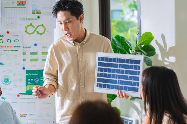 istock Diversity team presentation new design solar cell panel renewable energy innovation at office 2156727885