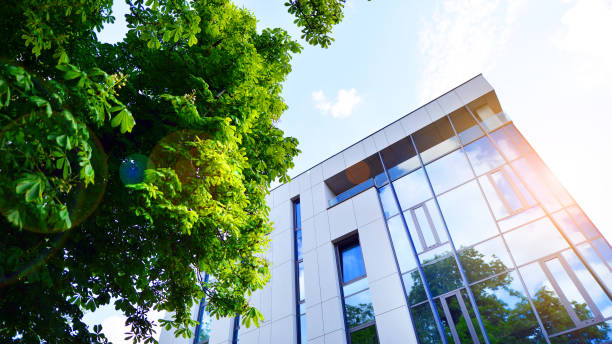 istock Sustainable glass office building with trees for reducing carbon dioxide. 2156729262