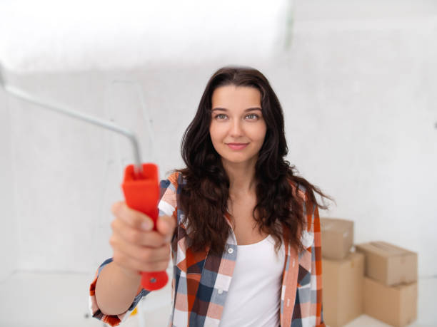 istock Happy Woman with Paint Roller Starting Home Improvement Task 2156730831