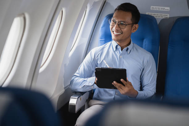 istock Successful business man, Airplane, travel, enjoying comfortable flight while sitting in the airplane cabin. 2156731441