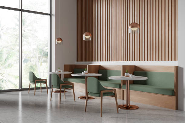 istock Cozy cafeteria interior with seats and tables, eating area with couch and window 2156733829