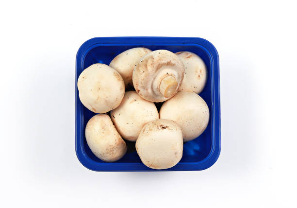 Isolated on white: brown button cremini mushrooms.