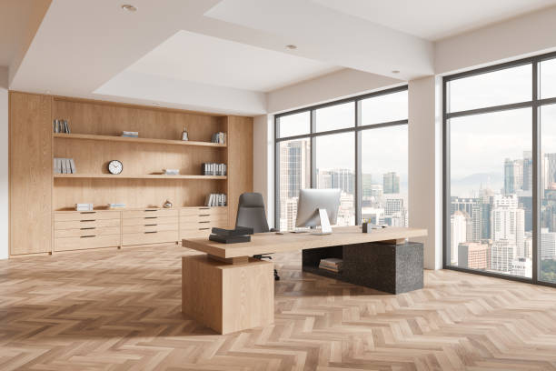 istock Cozy ceo business interior with work desk, pc desktop and shelf near window 2156735741