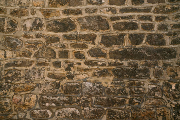 istock old brown stone wall texture and background, close up 2156735904