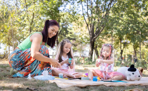 istock Joyful Sisters Playing Outdoors in a Summer Park 2156737848