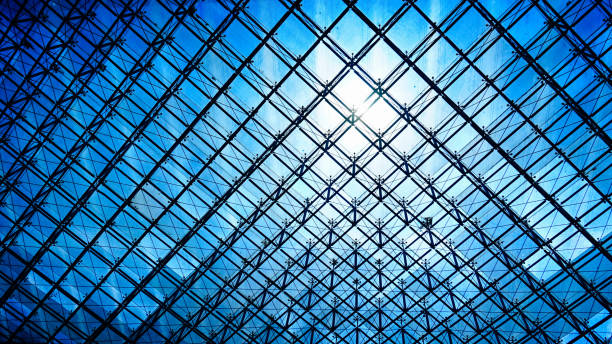 Paris, France - April 30, 2024: Historic facade of the Louvre Museum in Paris, France, illuminated by sunlight