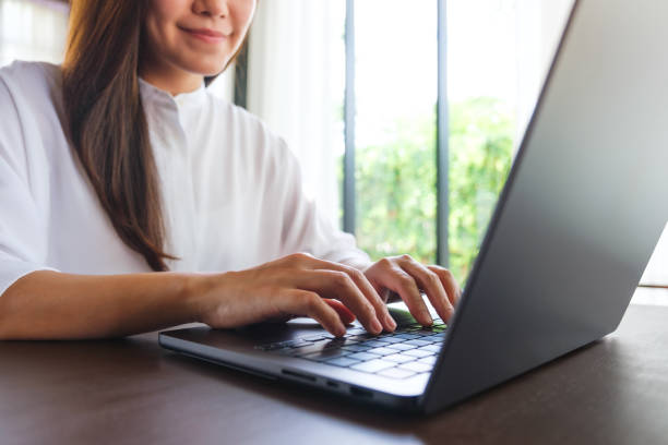 istock Closeup image of a woman working and typing on laptop computer keyboard 2156741133