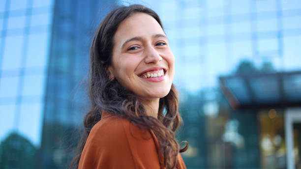 istock Happy young woman smiling and enjoying 2156741675