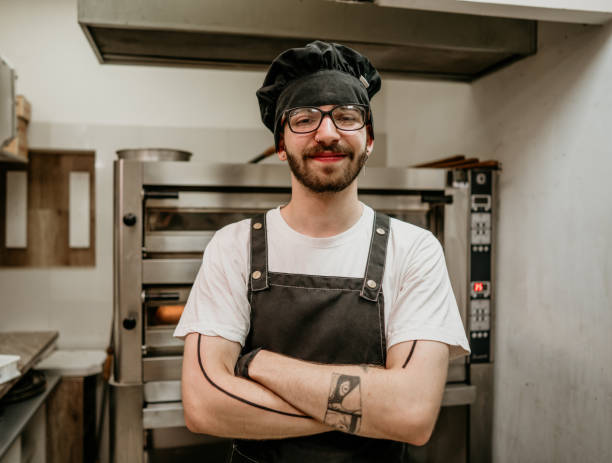 istock portrait of young handsome pizza baker chef 2156742921