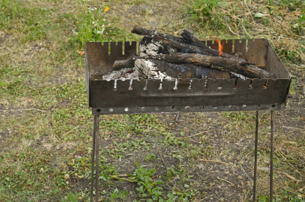 Firewood burns in the grill. barbecue grill