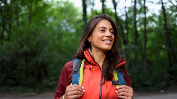 istock Happy girl smiling and enjoying while hiking 2156746355