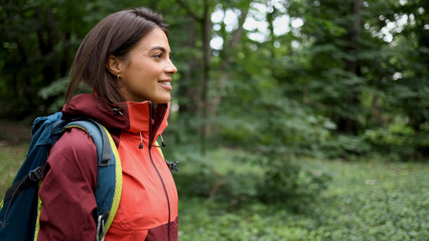 istock Happy girl smiling and enjoying while hiking 2156746521