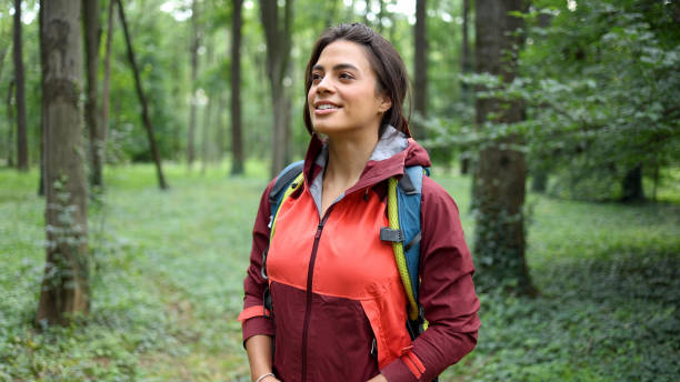 istock Happy girl smiling and enjoying while hiking 2156746567