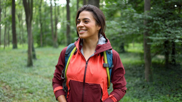 istock Happy girl smiling and enjoying while hiking 2156746569