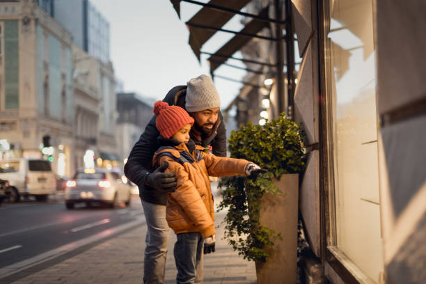 istock Window Shopping With Dad and Child at Sunset 2156752461