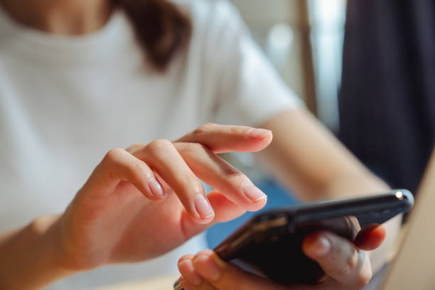 istock Hand holding smartphone and chatting online on mobile, During leisure time. 2156753886
