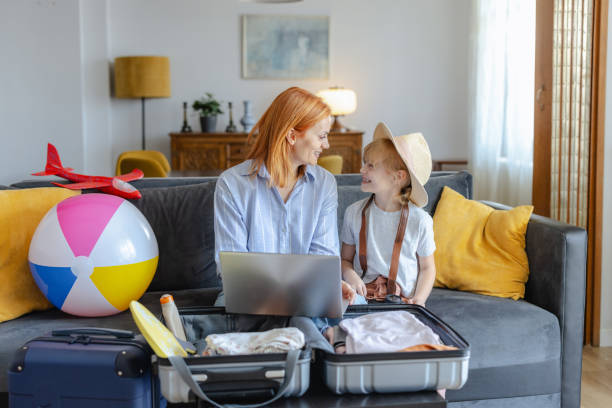 istock Mother and daughter choose a destination for their summer vacation 2156758855