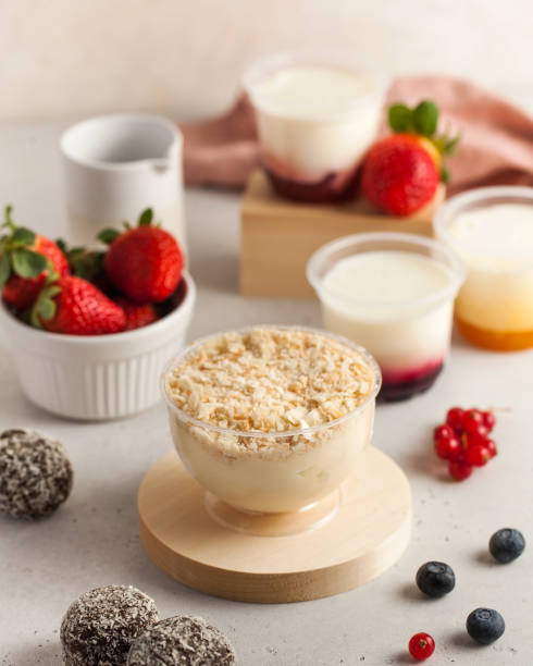 istock Dairy desserts with berries and candies on kitchen table 2156760316