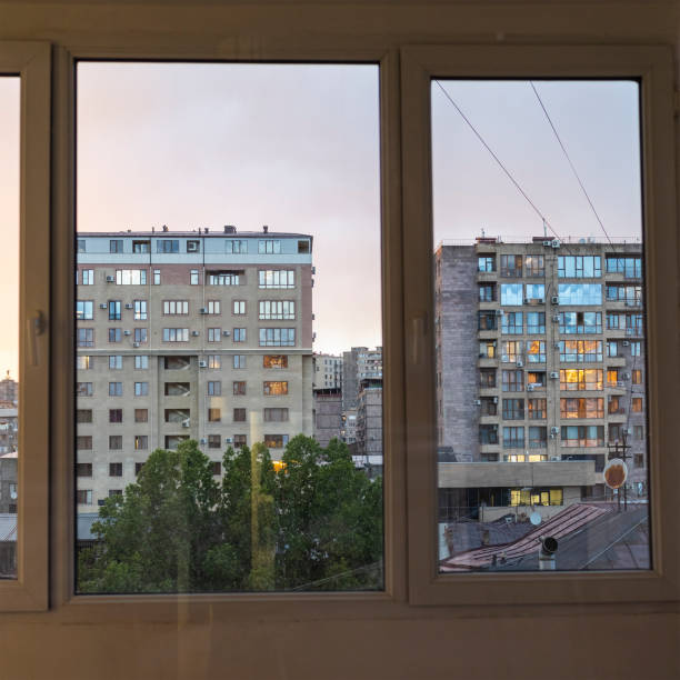 istock view of evening cityscape through windows 2156760481