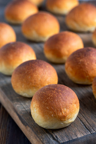 istock Freshly baked buns with a golden crust. 2156761355