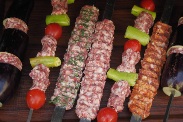 A tray of kebabs with meat and veggies a delicious dish on the table