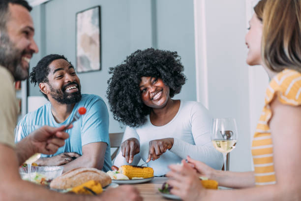 istock Cheerful friends enjoying party at home. 2156764519