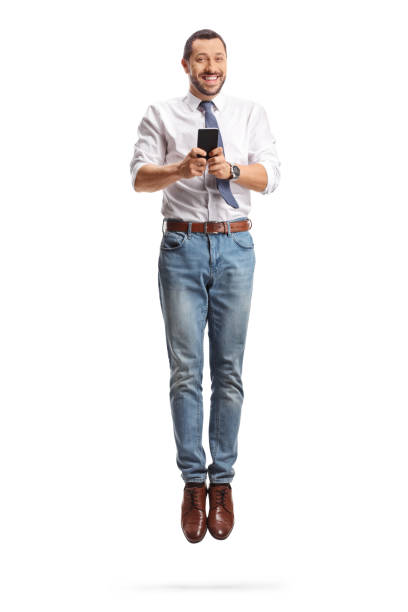 istock Happy businessman using a smartphone and jumping 2156766189