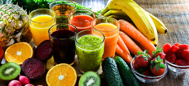 Glasses with fresh organic vegetable and fruit juices