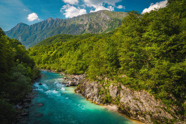 istock Soca river and high mountains in background, Kobarid, Slovenia 2156769199