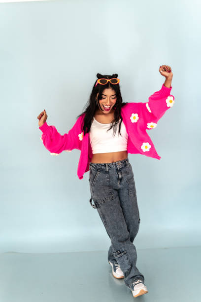 Young woman dancing on a studio shot