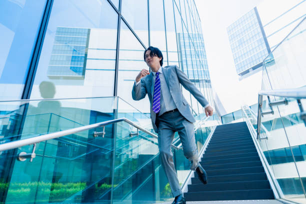 istock Businessmen in suits running as fast as they can. 2156771580