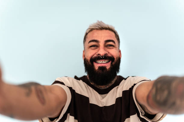 istock Mature man taking a selfie on studio shot - Camera point of view 2156771605