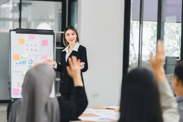 istock Businesswoman Leading Presentation with Team Participation. 2156771707