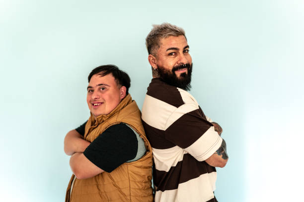 Portrait of friends on a studio shot - including young man with down syndrome