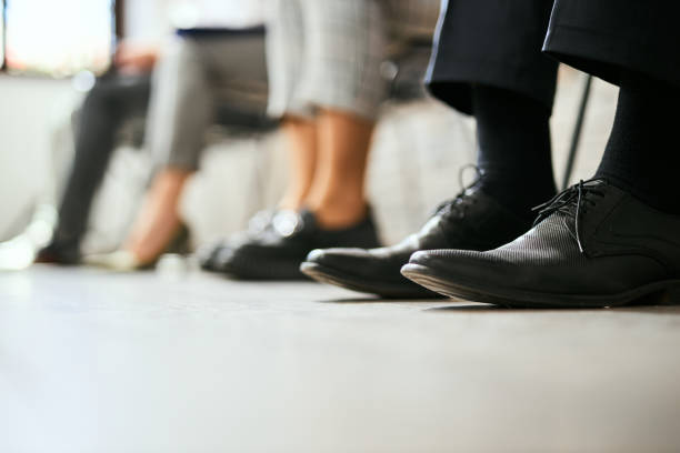 istock Group of unrecognizable people's leg in waiting room. 2156772980