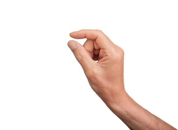 Hand holding a little bit of something, isolated on white background. Gesture indicating a pinch or