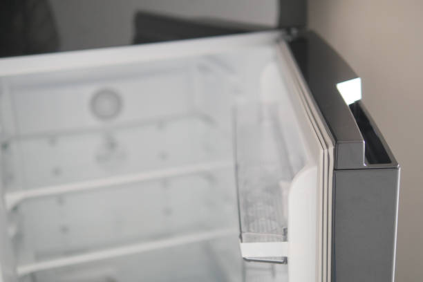 istock half open fridge with food and vegetables , 2156777438