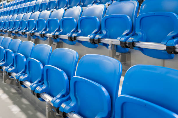 istock A long row of modern blue chairs with folding seats 2156777912
