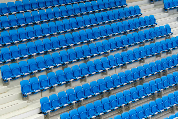istock A long row of modern blue chairs with folding seats 2156777915