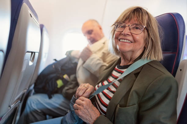 istock Senior couple travelling by plane 2156778174