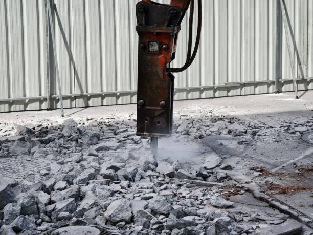 istock A hydraulic hammer breaking concrete at a construction site 2156778613