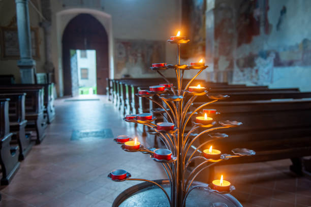 Antique wrought iron candelabra with lit candles