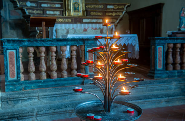 Antique wrought iron candelabra with lit candles