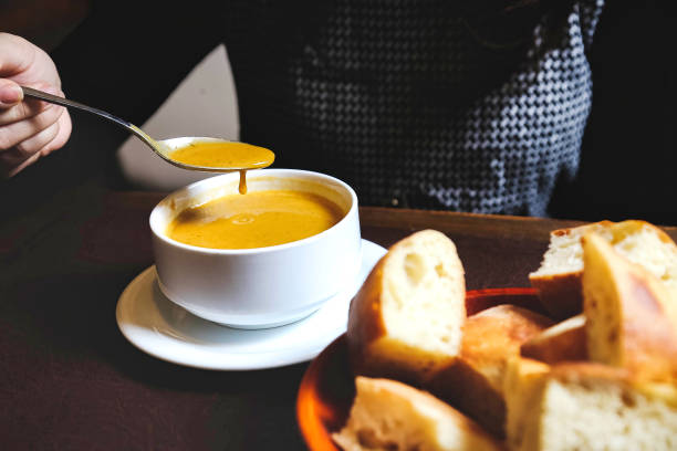 istock Steaming Bowl of Soup With Spoon 2156779189